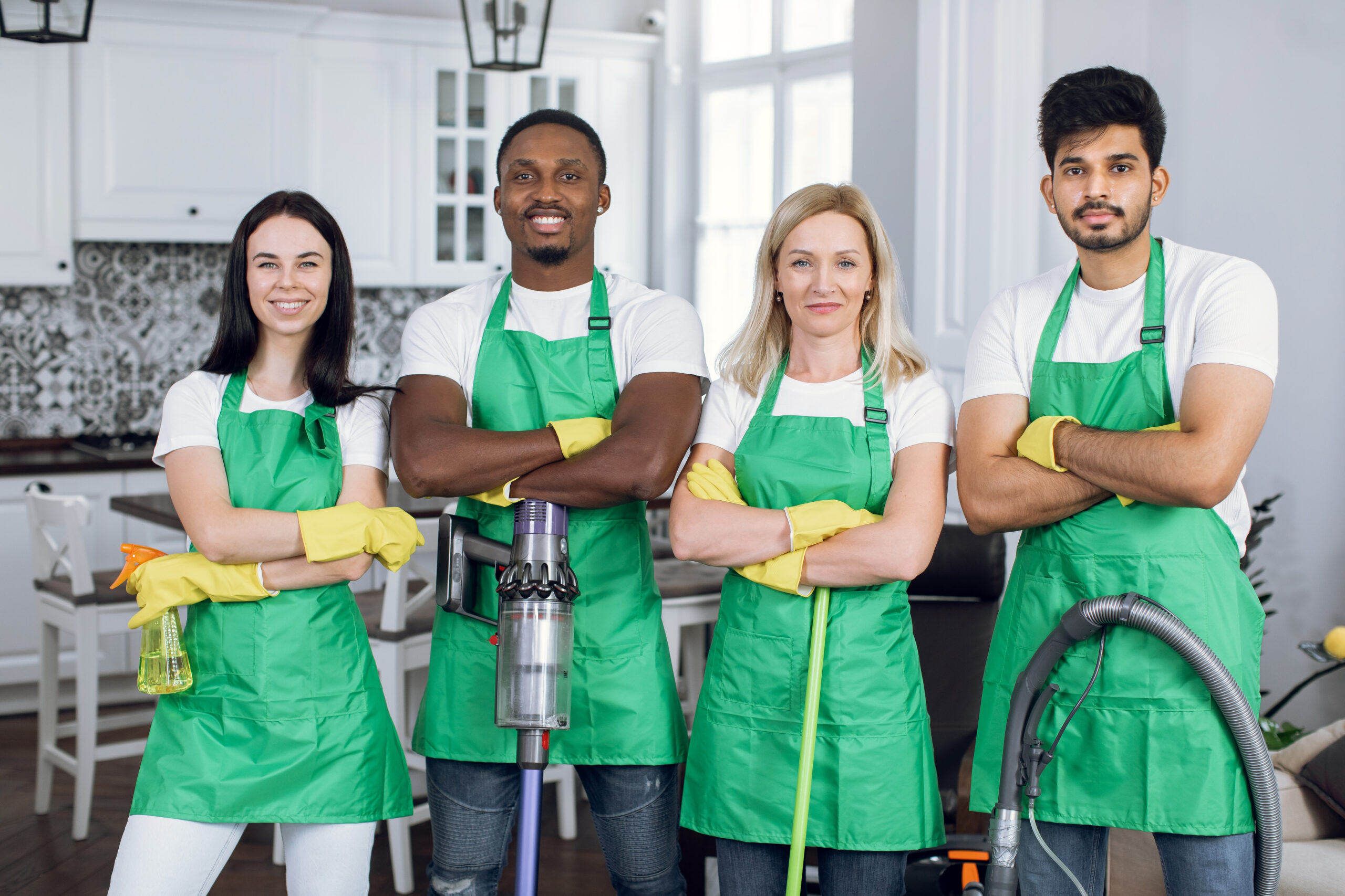 Professional cleaning team in a modern residential kitchen