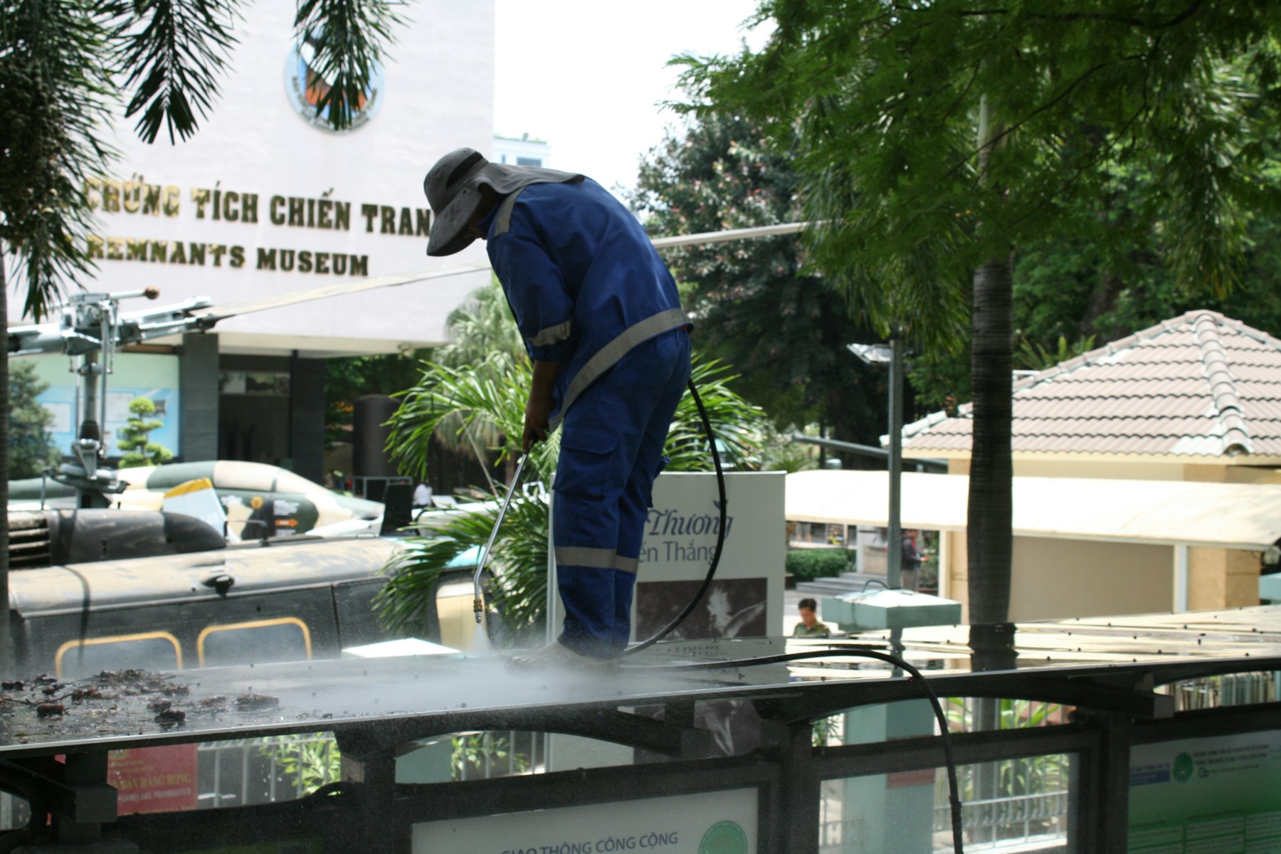 Worker pressure washing an exterior surface